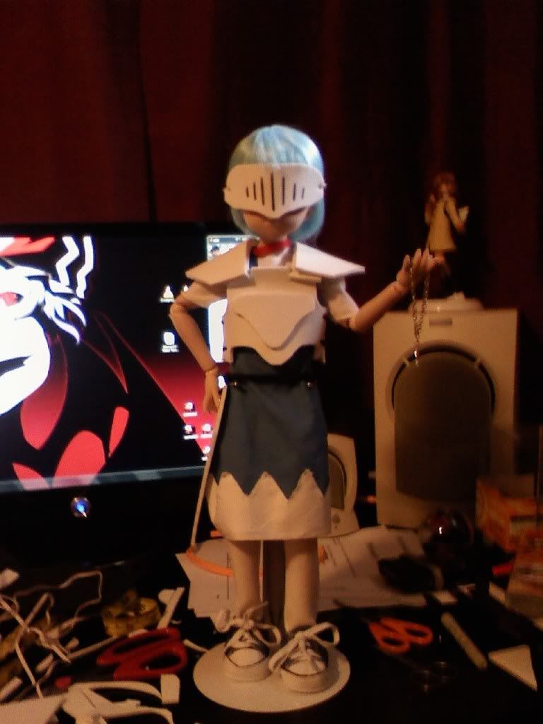 Cirno trying on her incomplete armor to make sure it fits well.