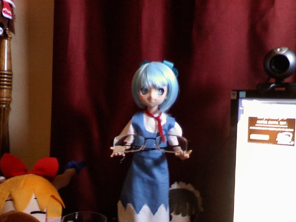 Cirno holding Tai's glasses
